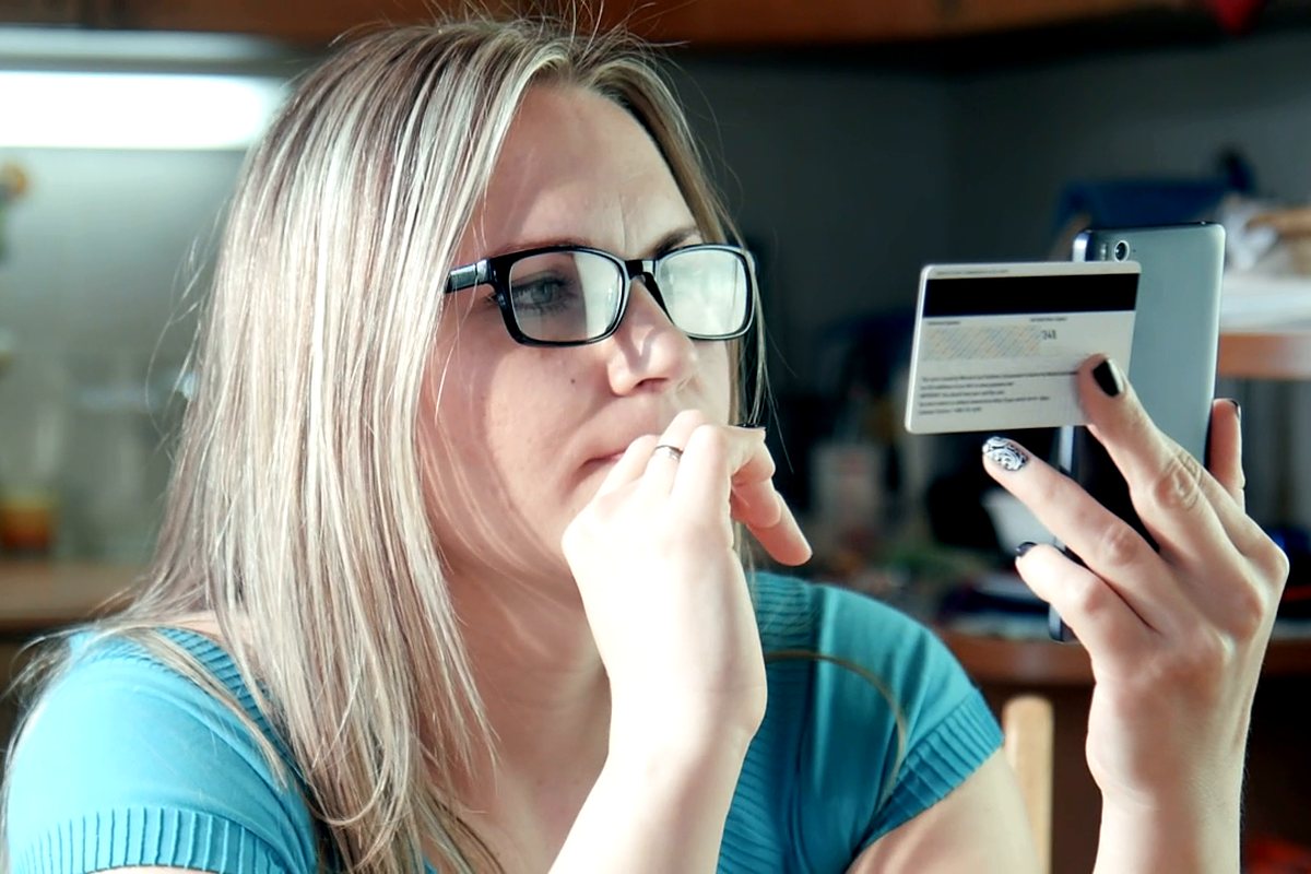Shopper paying for an order on her phone
