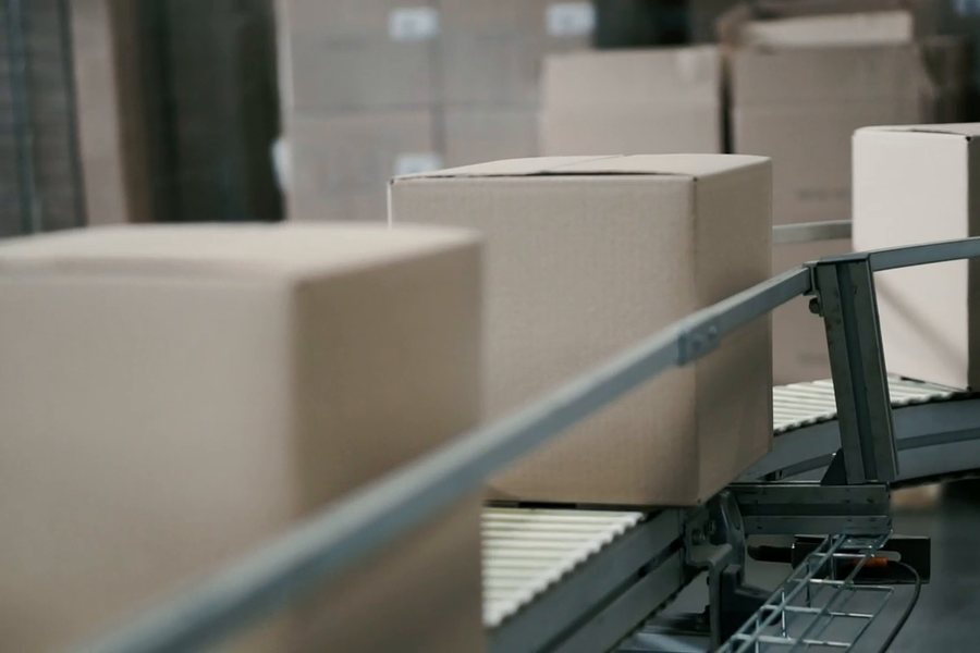 Parcels moving along a conveyor